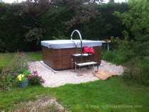 spa exterieur avant pose entourage bois